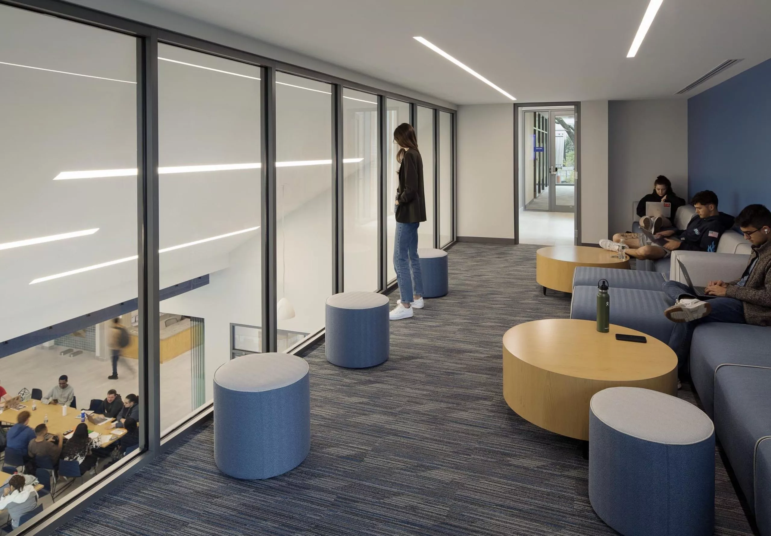 Students working in lounge area in Southern Connecticut State University School of Business