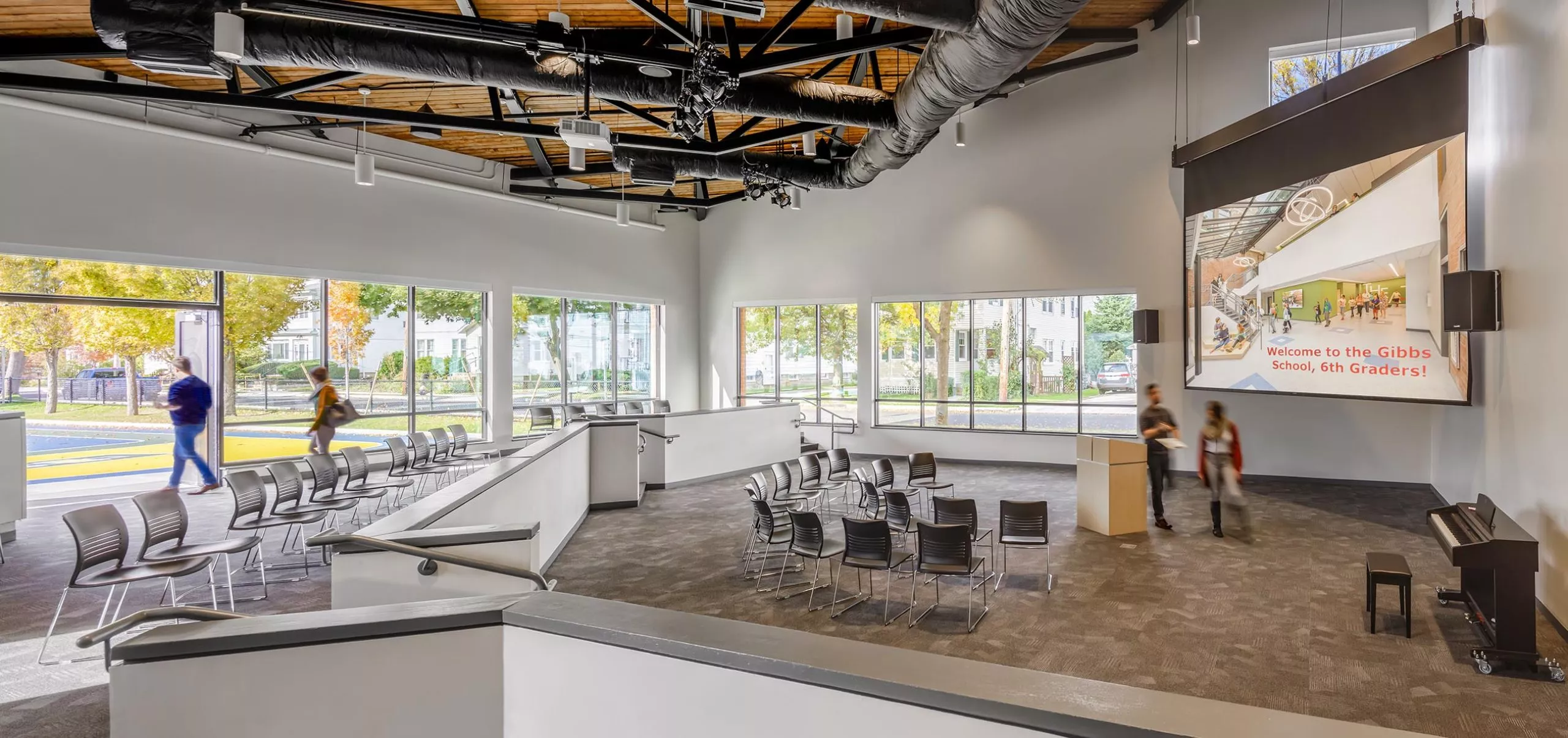 Chairs facing projector and podium in Gibbs School