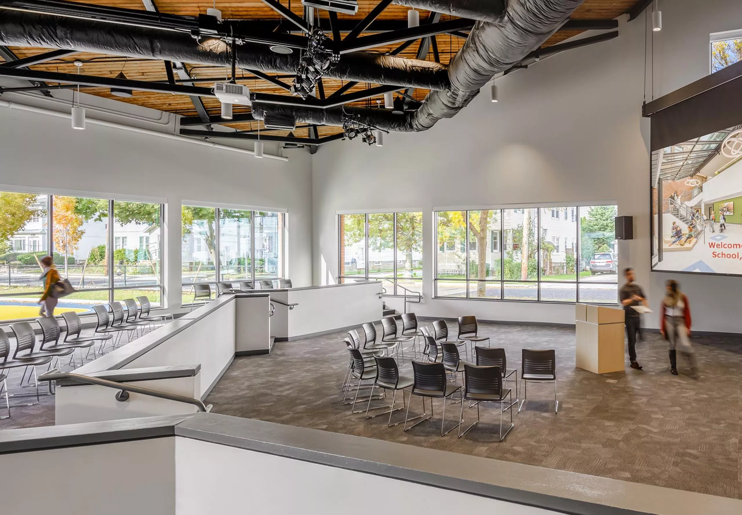 Chairs facing projector and podium in Gibbs School