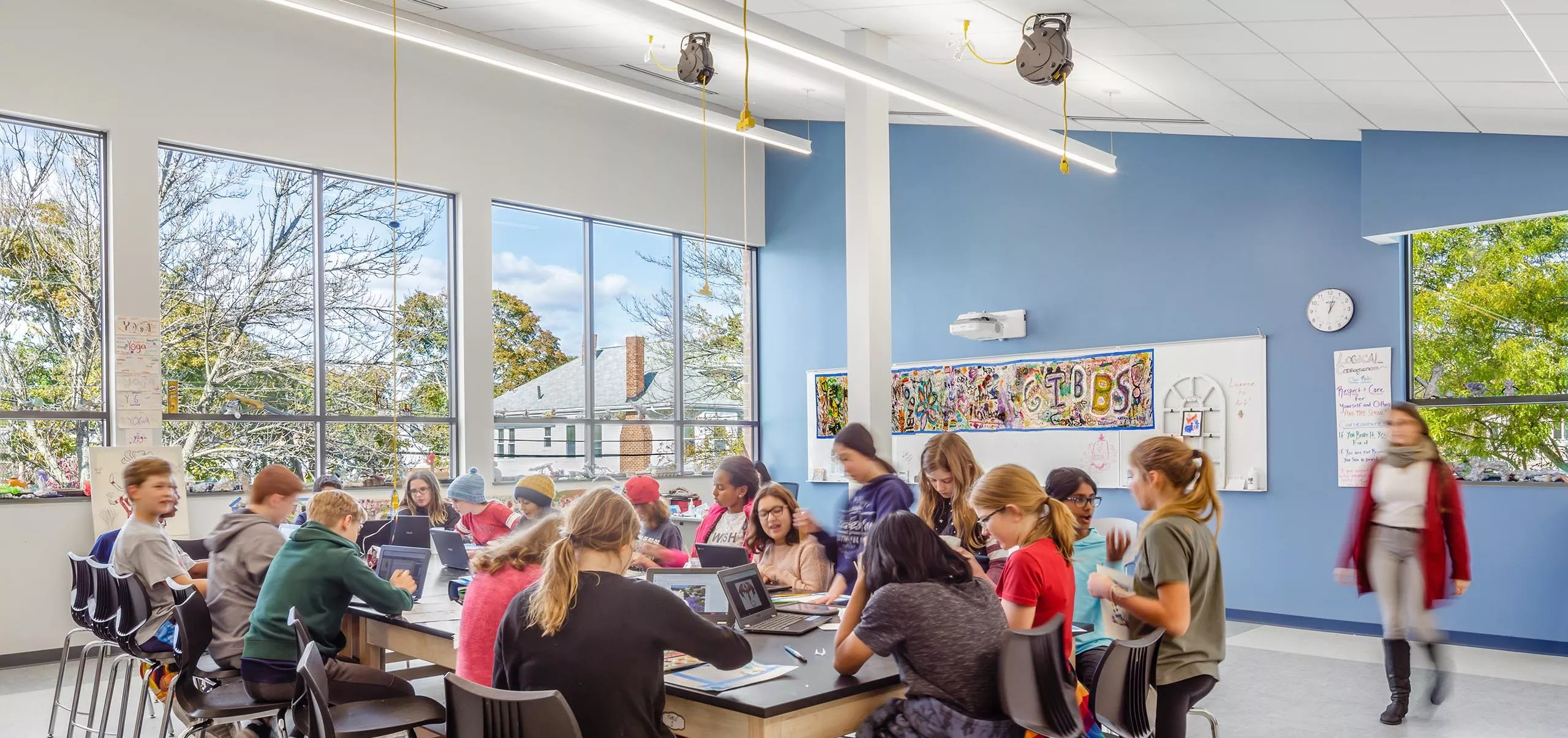 Students sitting around large table at Gibbs School