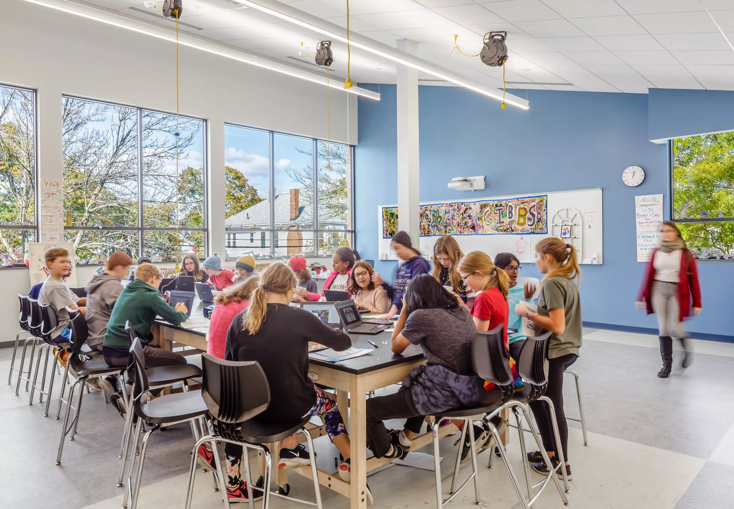 Students sitting around large table at Gibbs School