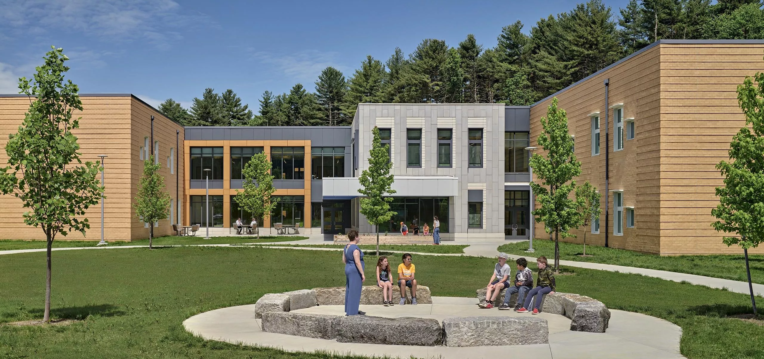 Outdoor seating and landscape outside of David Mindess Elementarry School