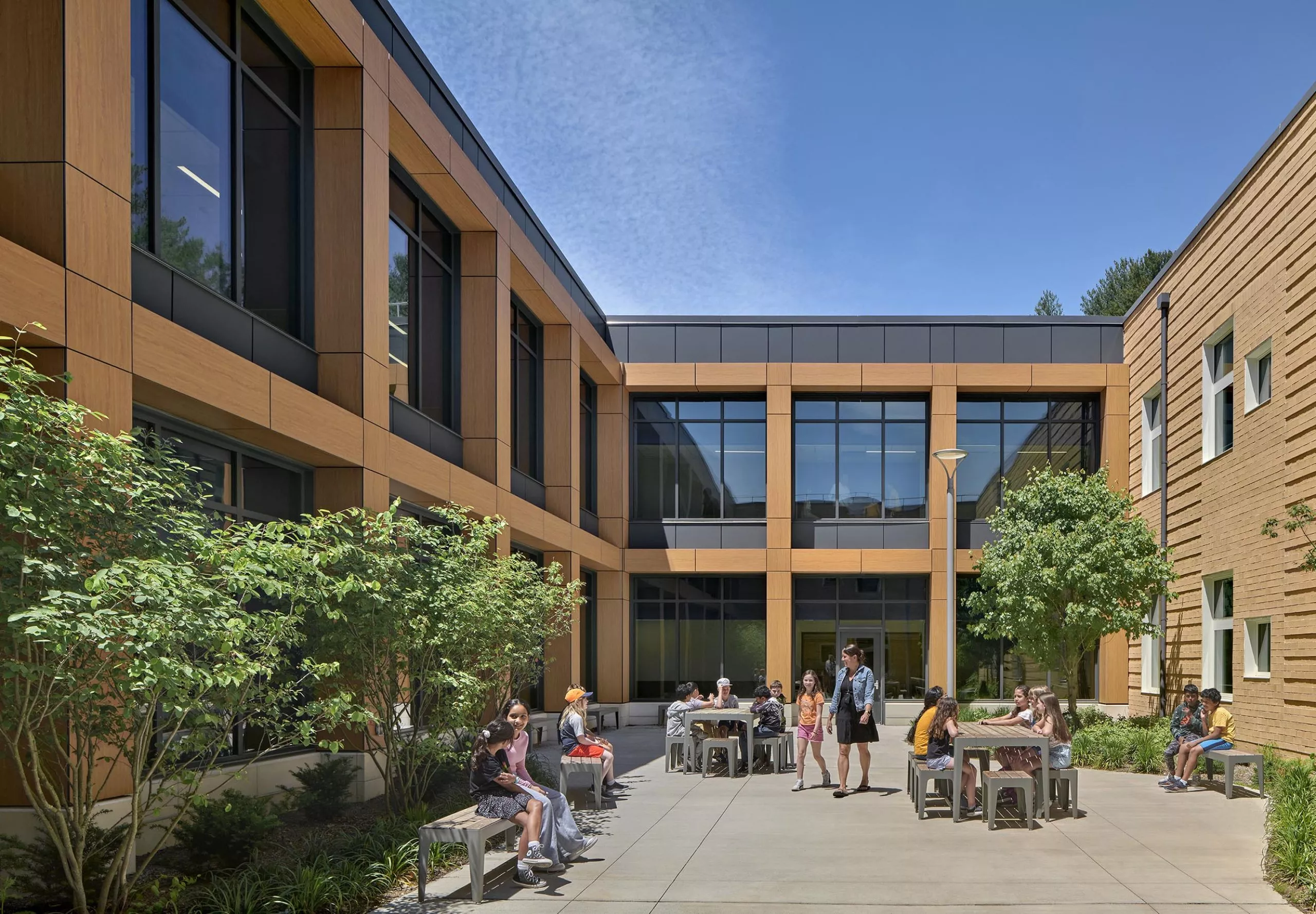 Outdoor seating in courtyard at David Mindess Elementarry School