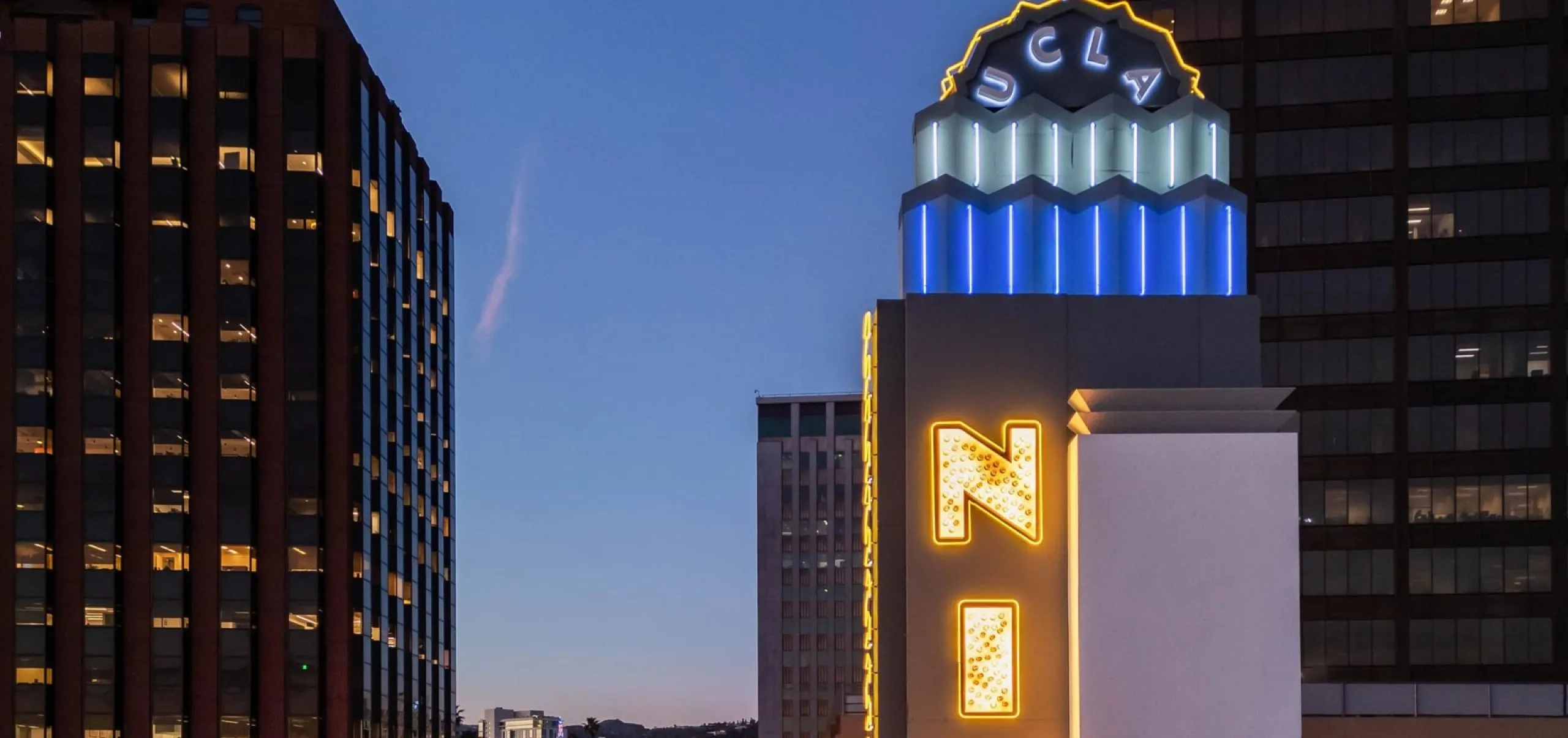 exterior view of the Nimoy Theater sign lit up at night