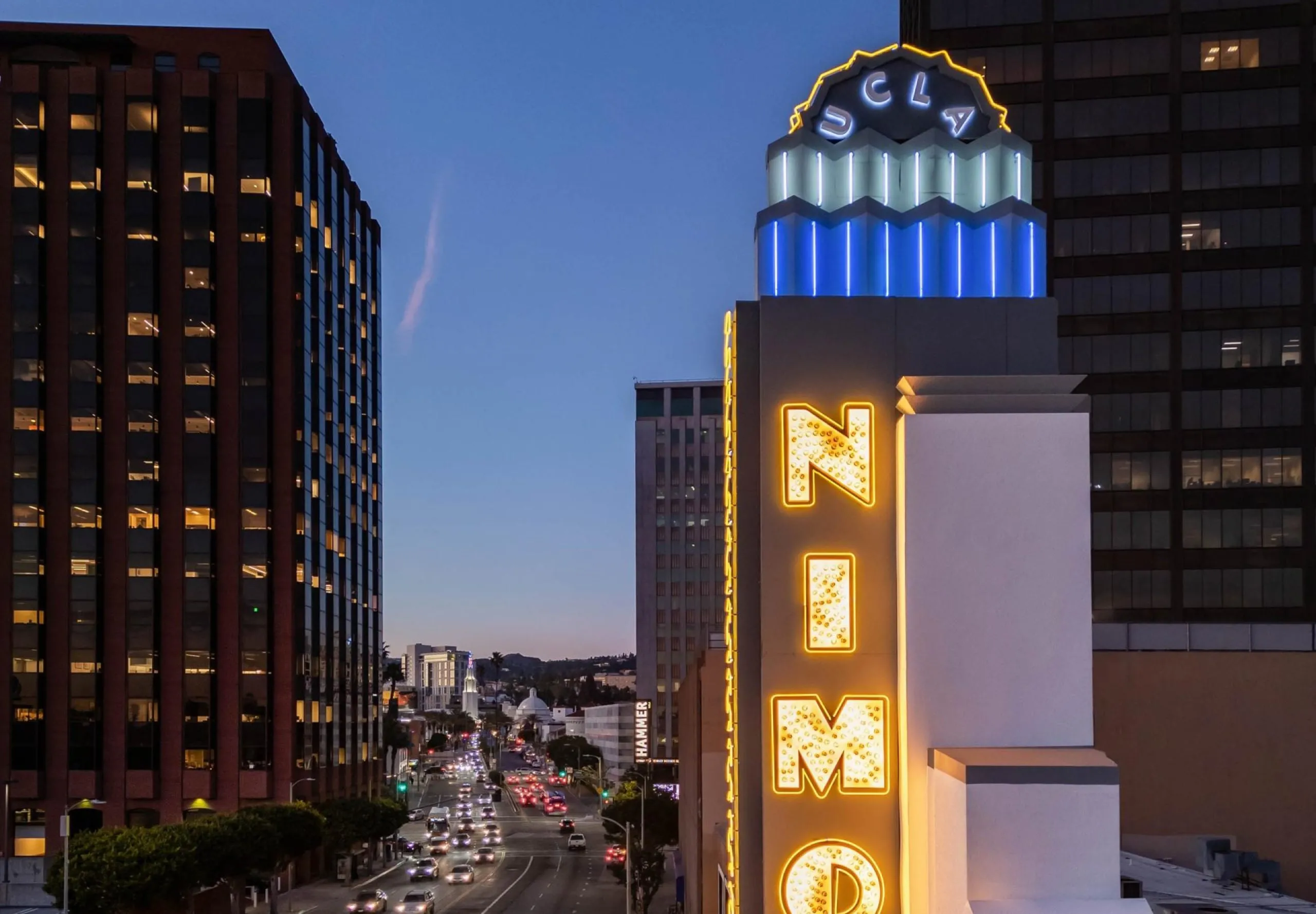 exterior view of the Nimoy Theater sign lit up at night