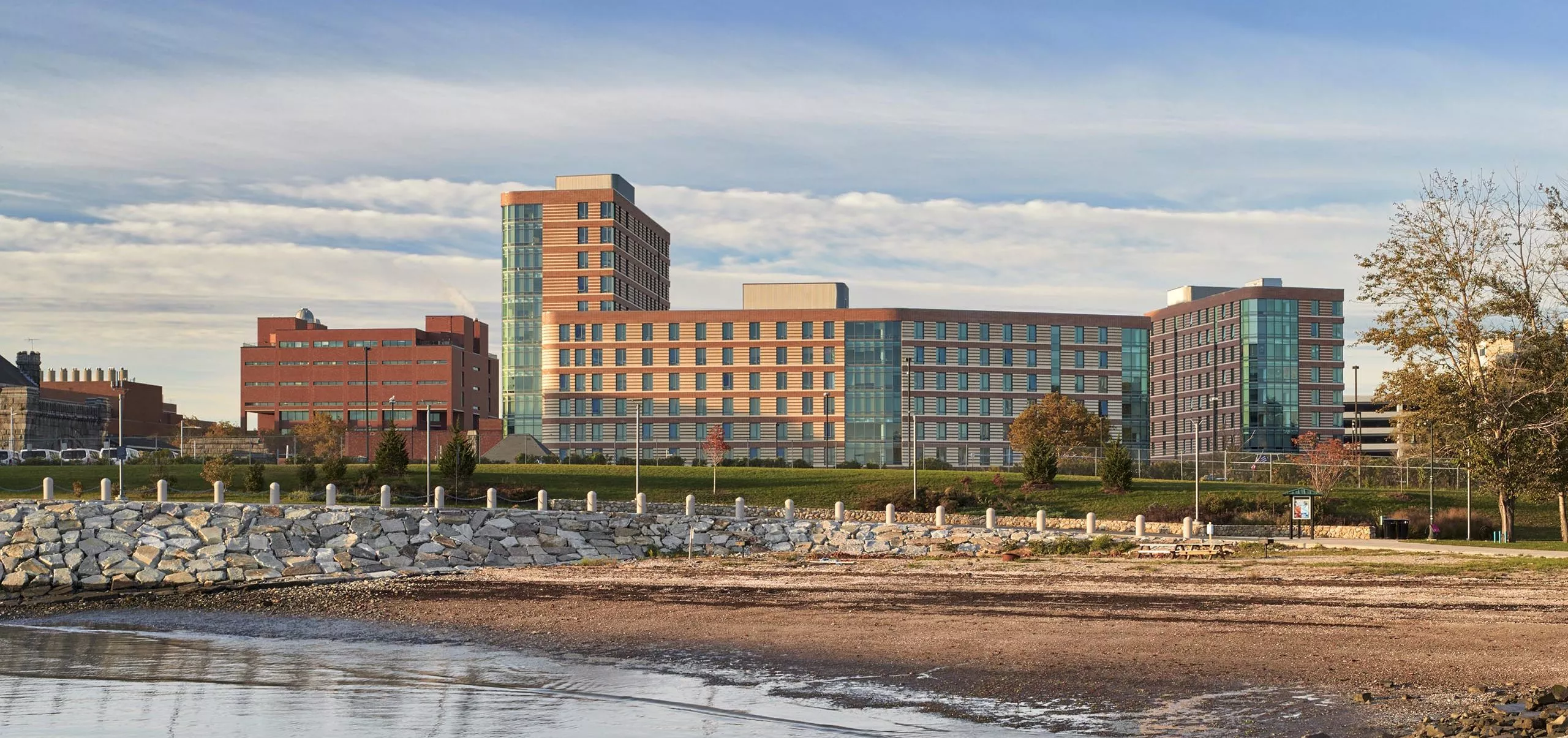 River bed with UMass Residence Hall in the distance