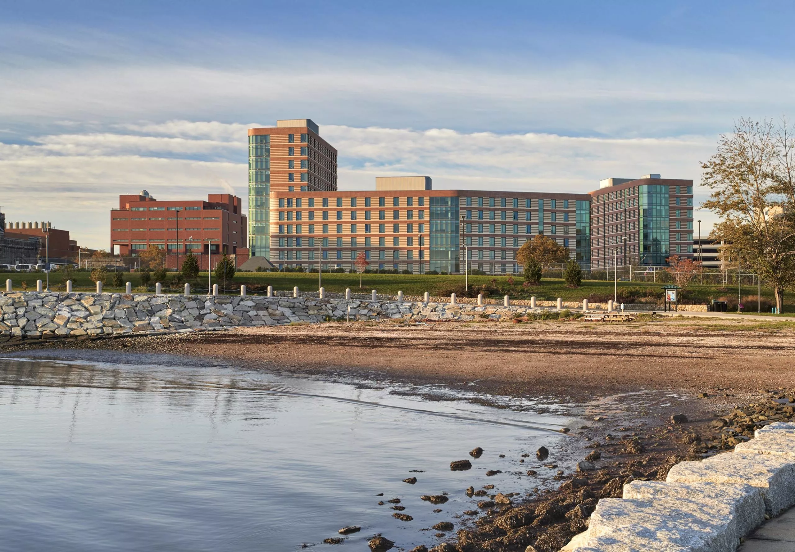 River bed with UMass Residence Hall in the distance