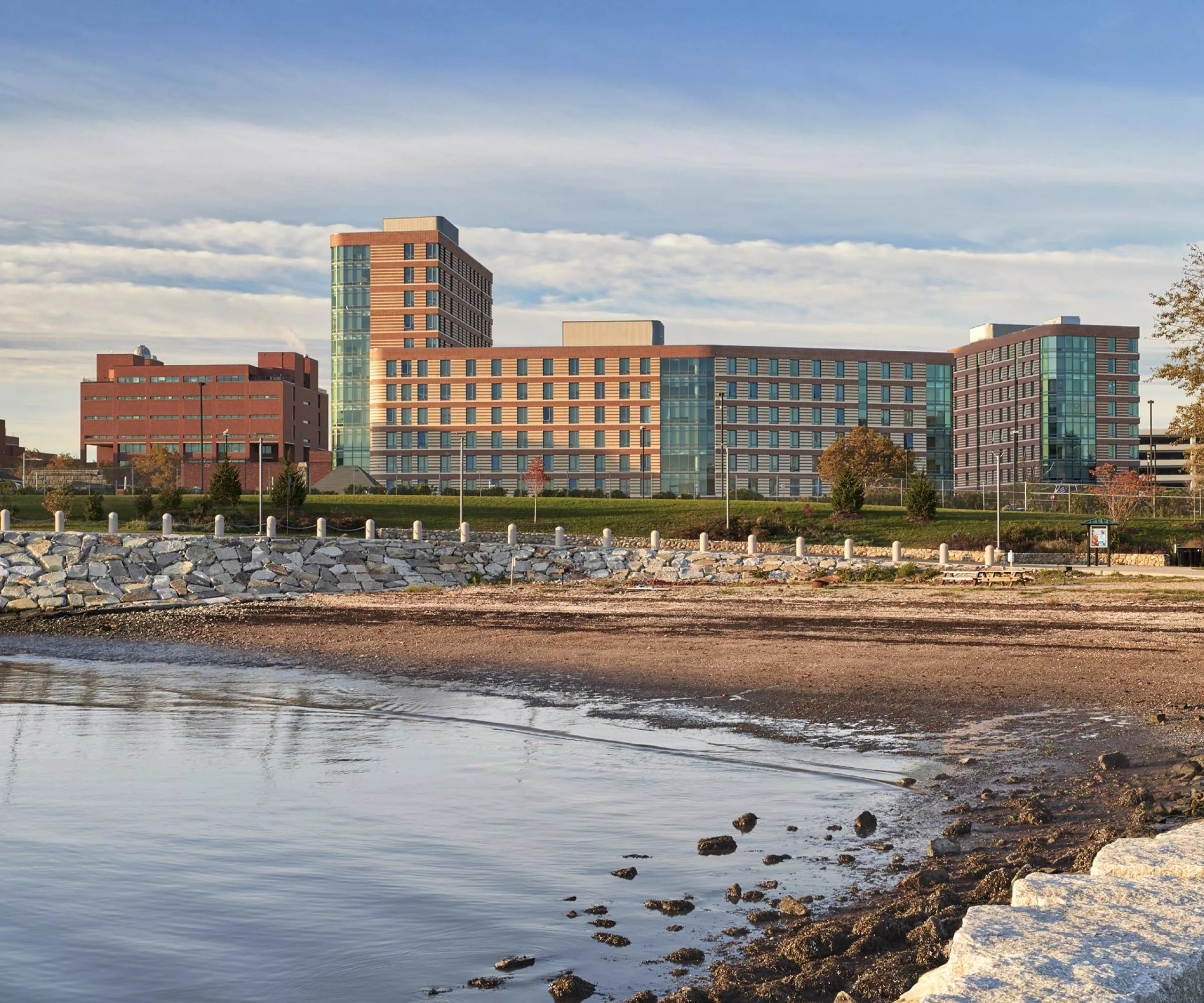 River bed with UMass Residence Hall in the distance