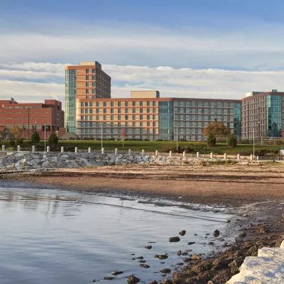 River bed with UMass Residence Hall in the distance