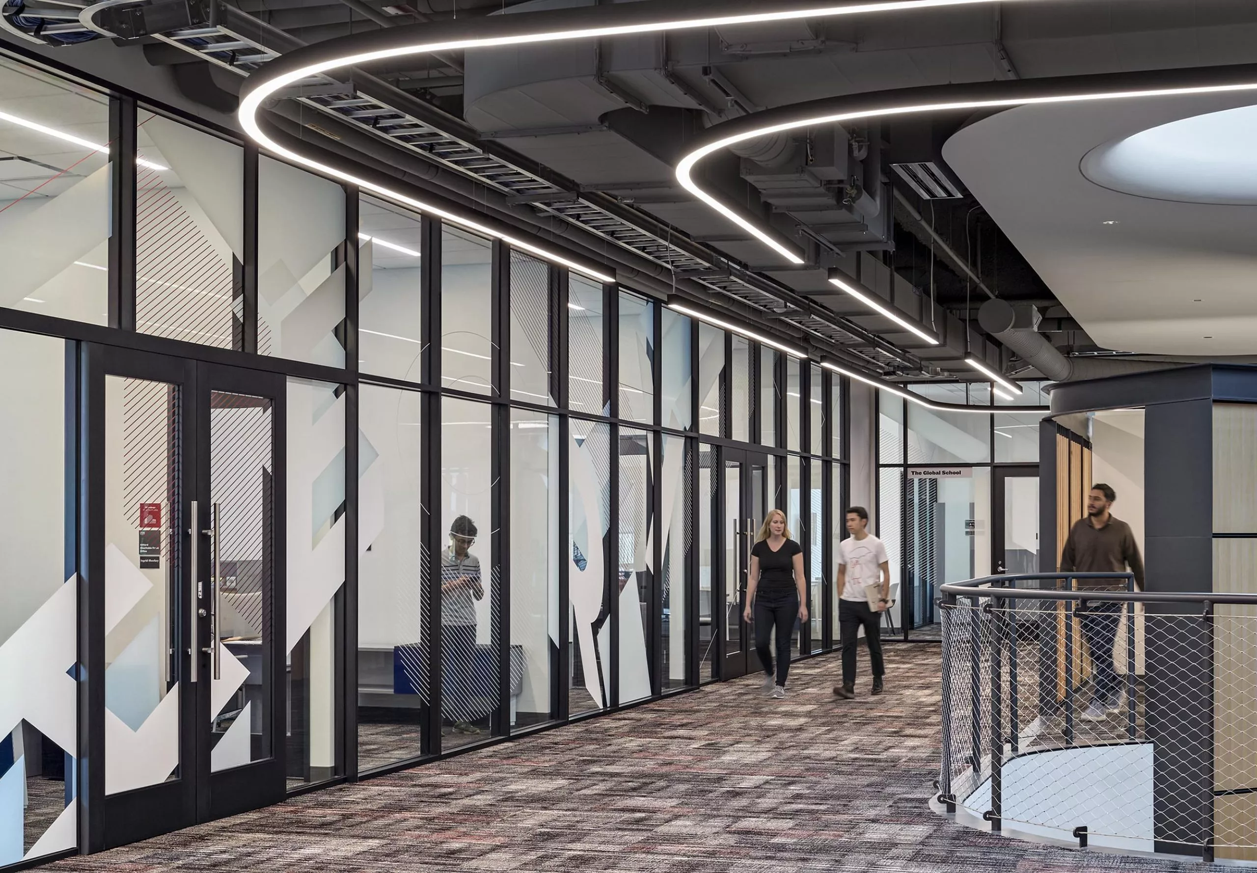 People walking in a hallway in Ithe nnovation Studio & Messenger Residence Hall