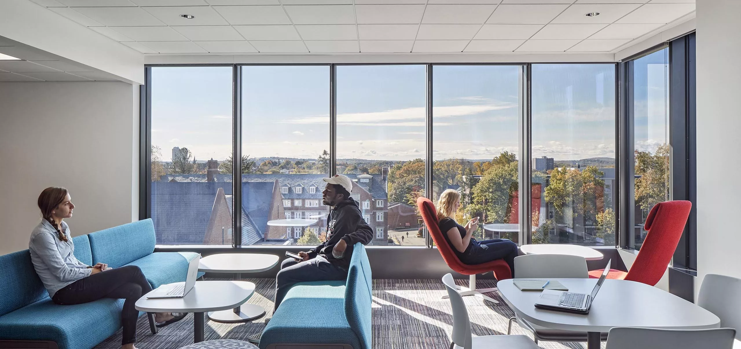 People sitting in a communal space in Innovation Studio & Messenger Residence Hall