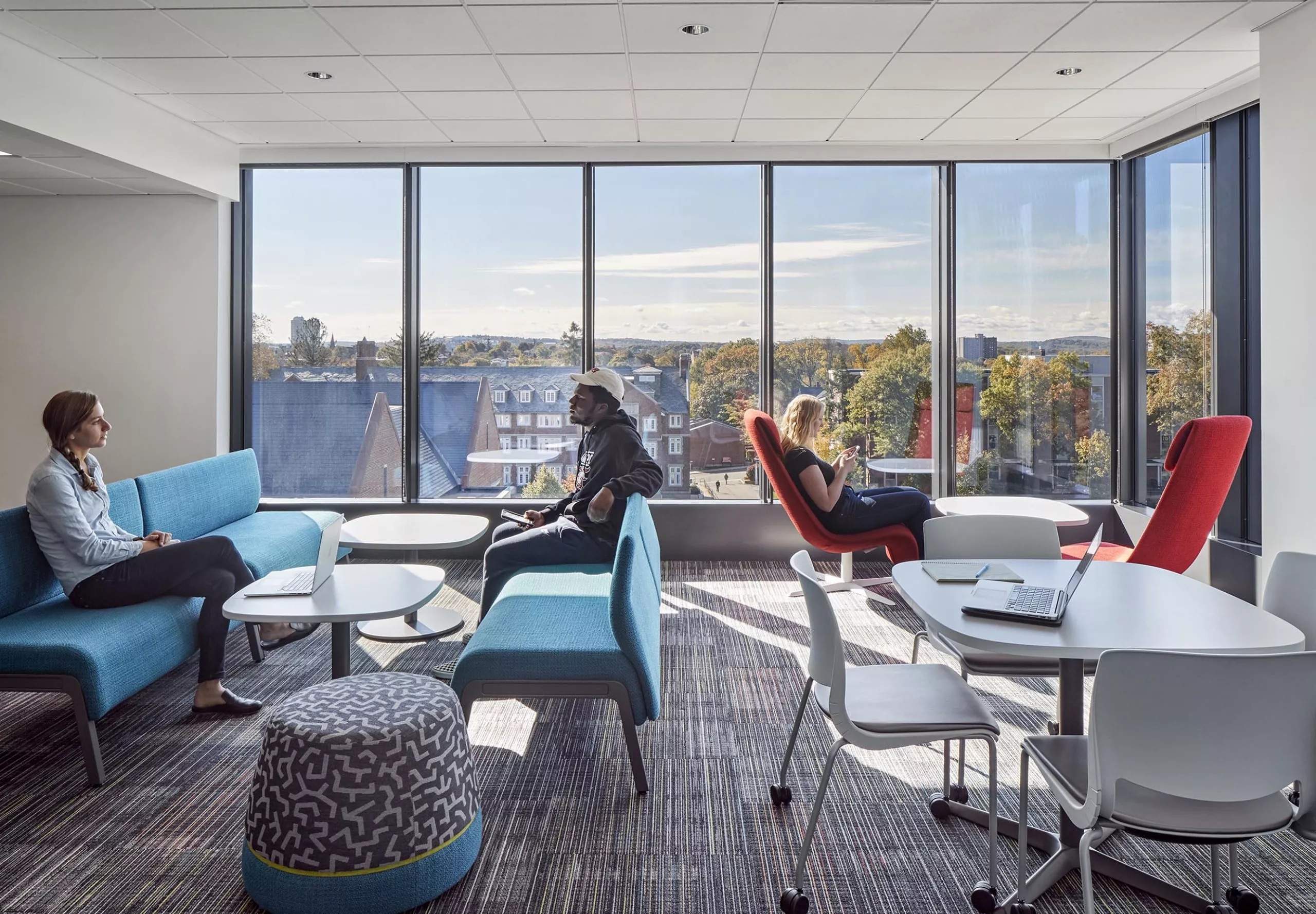 People sitting in a communal space in Innovation Studio & Messenger Residence Hall