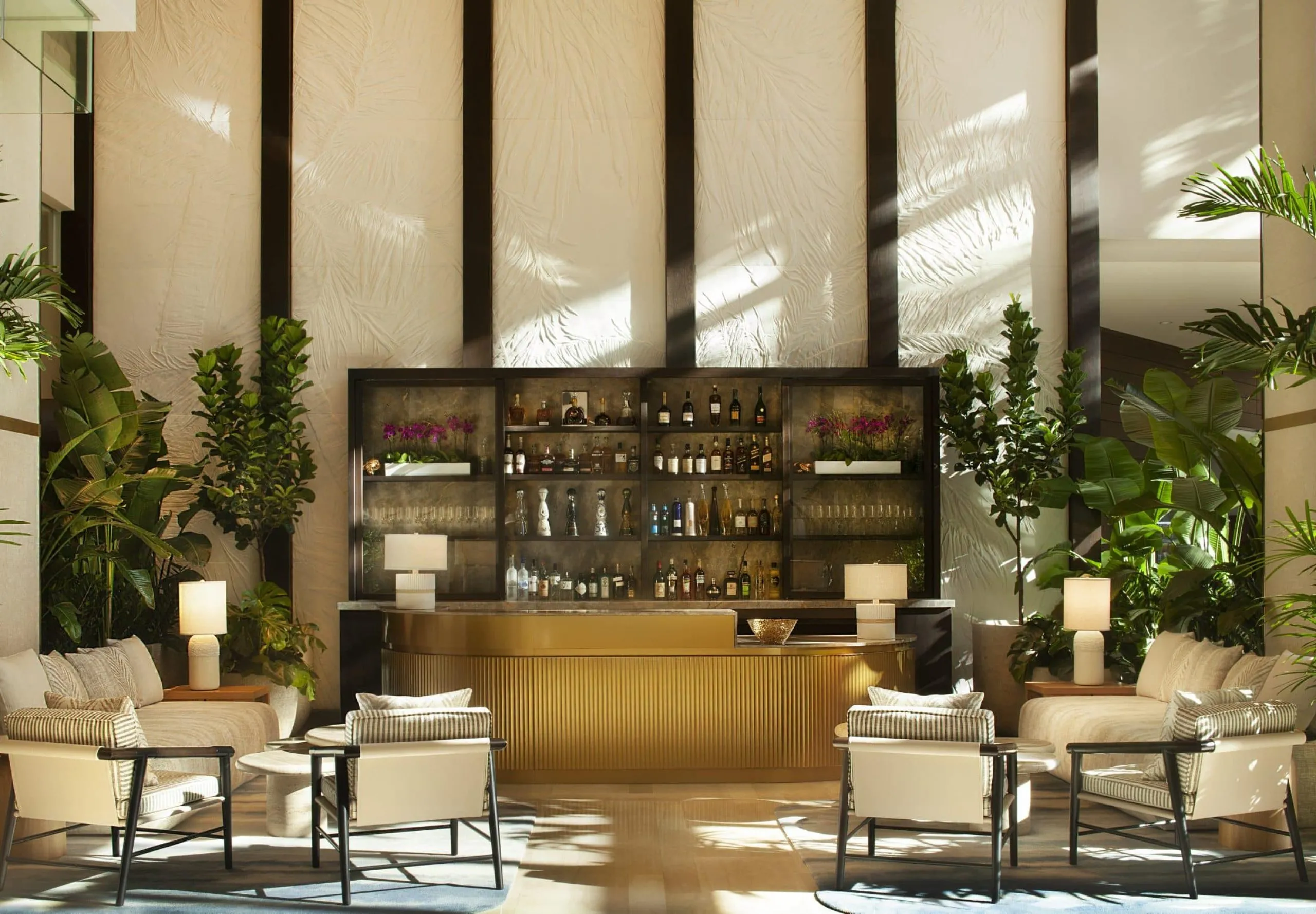 Hilton West Palm Beach lobby and bar area with many indoor plants